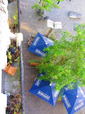 a group of blue umbrellas sitting on the ground at Vakantielogies Faja lobi in Ghent