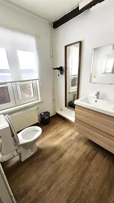 a bathroom with a toilet and a sink at CEP ECUYER in Brussels