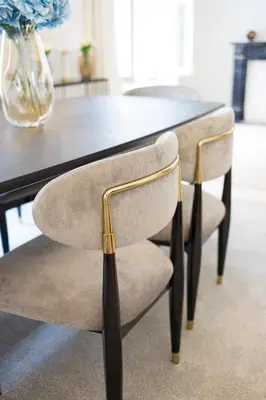 a dining room table with two chairs in front of it at Appartement dans l'hypercentre in Brussels