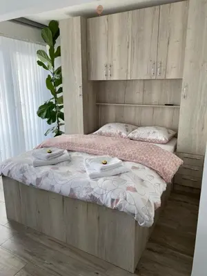 a bedroom with a bed with two towels on it at Zwarte Arend AirBnB in Antwerp