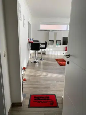 a room with a red sign on the floor next to a door at Zwarte Arend AirBnB in Antwerp