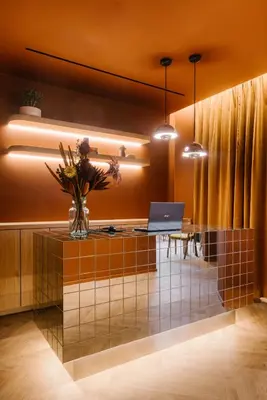 an office with a desk with a laptop on it at Maison Arya in Brussels