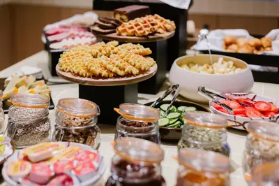 a buffet with many different types of food on a table at Maison Arya in Brussels