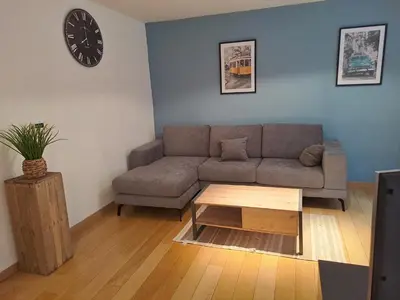 a living room with a couch and a coffee table at bel etage woning in Ghent
