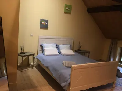 a bedroom with a bed with two pillows on it at Gastroatelier in Gooik