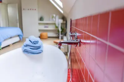 a bathroom with a sink with a towel on the counter at Casa Mina - Dok Noord Ghent in Ghent