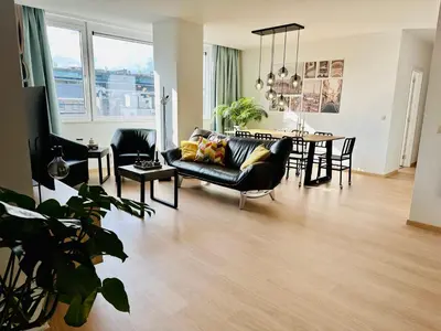 a living room with a couch and a table at Urbanstay Suites - Grand Place 2 Bd Apartment in Brussels