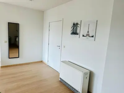 a white room with a television and a mirror at Urbanstay Suites - Grand Place 2 Bd Apartment in Brussels