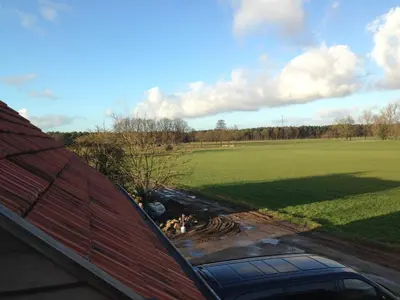a view of a field from the roof of a house at B&B Droomzoet in Herentals