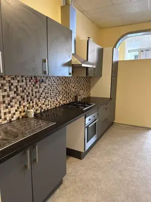 a kitchen with a sink and a stove at Appartement à Bruxelles Midi - Grand place Bruxelles in Brussels