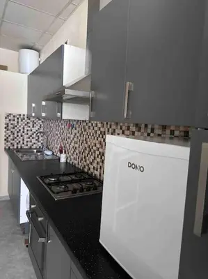 a kitchen with a stove and a counter top at Appartement à Bruxelles Midi - Grand place Bruxelles in Brussels