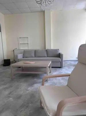 a living room with a couch and a coffee table at Appartement à Bruxelles Midi - Grand place Bruxelles in Brussels