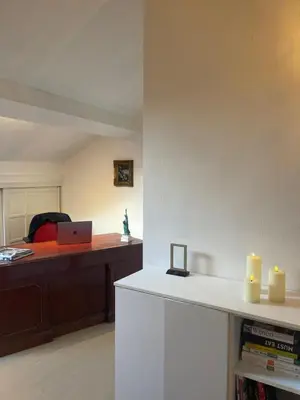 a room with a desk with a laptop and candles at The Doors City Park House in Ghent