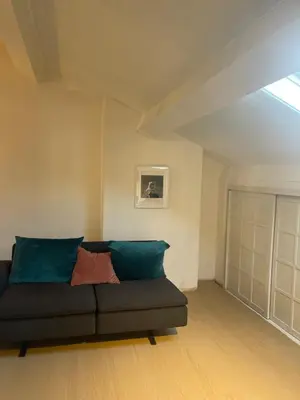 a living room with a couch in a room at The Doors City Park House in Ghent