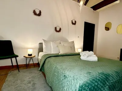 a bedroom with a bed with two towels on it at Luxury Suites Stay by Rikas Hotels in Antwerp