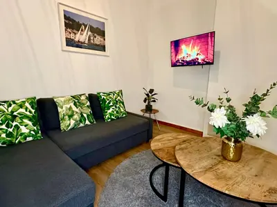 a living room with a couch and a table at Luxury Suites Stay by Rikas Hotels in Antwerp
