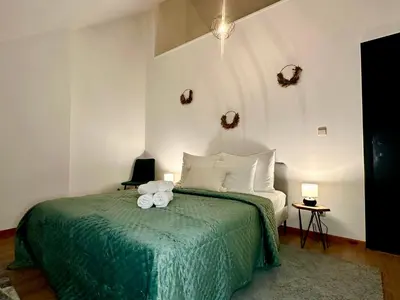 a bedroom with a bed with two towels on it at Luxury Suites Stay by Rikas Hotels in Antwerp