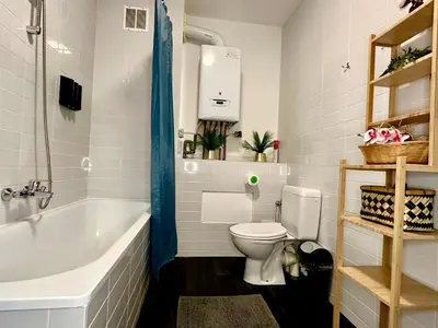 a bathroom with a white tub and a toilet at Luxury Suites Stay by Rikas Hotels in Antwerp
