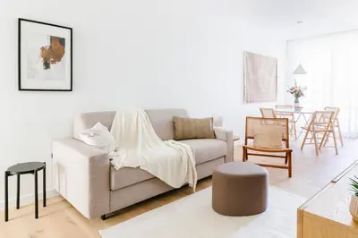 a living room with a couch and a table at High-end flats at South area in Antwerp