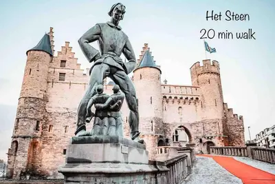 a statue of a man standing in front of a castle at Private studio in Antwerp in Antwerp