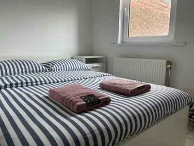 two towels sitting on top of a bed at Private studio in Antwerp in Antwerp