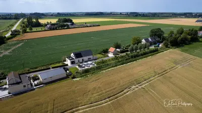an aerial view of a farm with a field at Vakantiehuis Paula in Watervliet