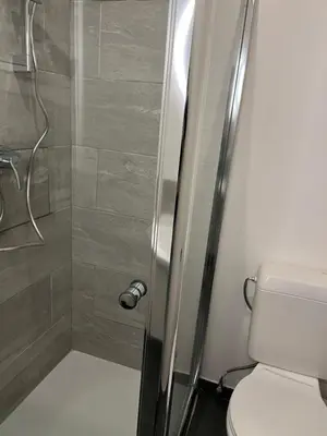 a bathroom with a shower with a toilet at Brussels center flat in Brussels