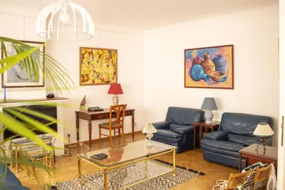 a living room with two blue couches and a table at Elegance ,Space & Luxury in Brussels in Brussels