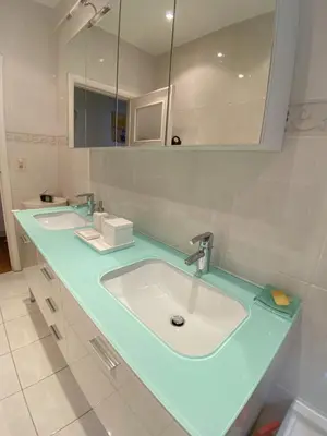 a bathroom with two sinks and a large mirror at Elegance ,Space & Luxury in Brussels in Brussels