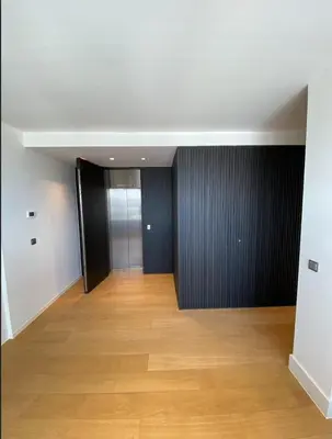 an empty room with a wooden floor and a door at Business Accommodation Luxury Loft in Geel