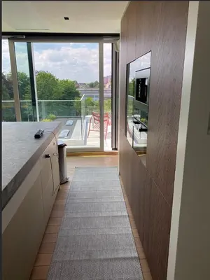 a hallway of a house with a view of a balcony at Business Accommodation Luxury Loft in Geel
