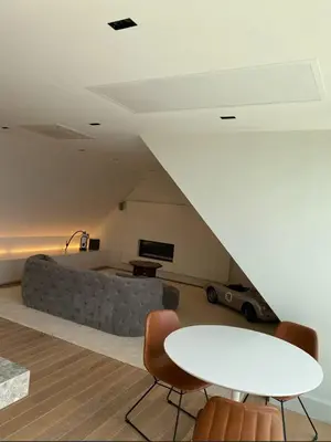 a living room with a couch and a table at Business Accommodation Luxury Loft in Geel