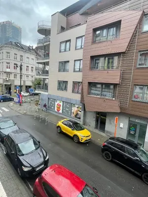 a group of cars parked on a city street at cantillonn in Brussels