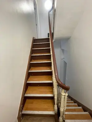 a staircase with wooden steps in a building at cantillonn in Brussels