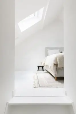 a white bedroom with a bed and a window at High-end 3BDR apartment @ city center in Antwerp