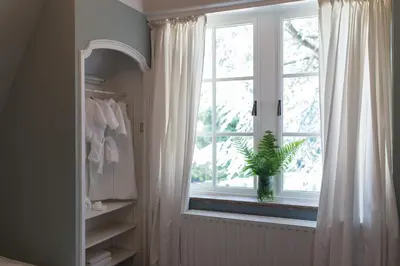 a bathroom with a window with a plant in it at Edville Home in Ghent