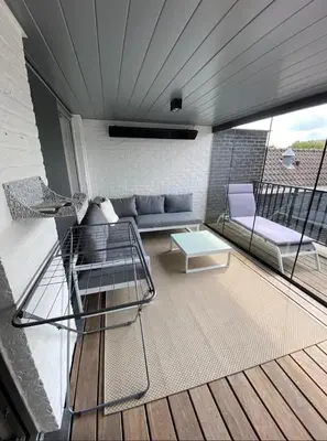 a living room with a couch and a table at Business Accommodation Luxury XL Geel in Geel