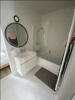 a bathroom with a sink and a shower and a mirror at Business Accommodation Luxury XL Geel in Geel