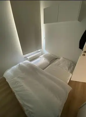 a bedroom with a white bed in a room at Business Accommodation Luxury XL Geel in Geel