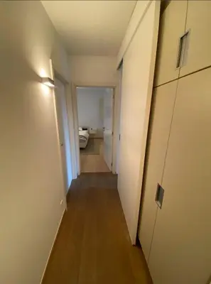 a hallway leading to a room with a bed at Business Accommodation Luxury XL Geel in Geel