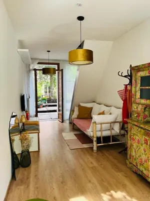 a living room with a couch and a table at foodiejive appartement 2 in Antwerp