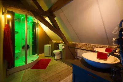 a large bathroom with a shower and a sink at B&B Oase in Londerzeel
