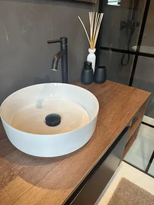 a white bowl sink on a counter in a bathroom at Antwerp West Side, TERRACE in Zwijndrecht