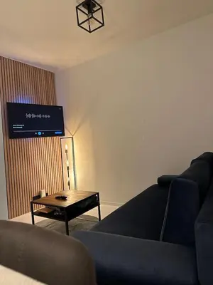 a living room with a couch and a table at Antwerp West Side, TERRACE in Zwijndrecht
