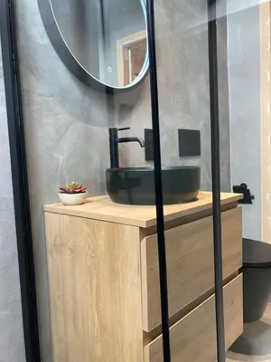 a bathroom with a sink and a mirror at Chez Roya in Zaventem