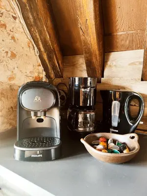 a kitchen counter with a toaster and a bowl of food at Rooftop apartment with 60m terrace overlooking the cathedral in Antwerp