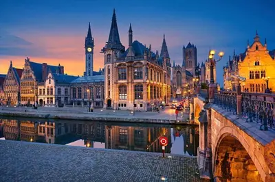 a city with a bridge and buildings and a clock tower at Historic Center Apartment Walk to Everything in Ghent
