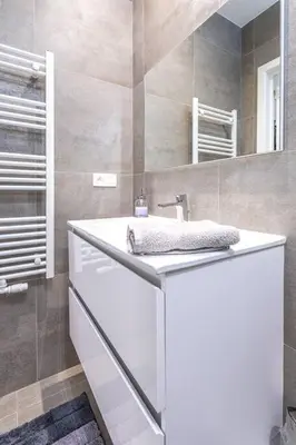 a bathroom with a sink and a mirror at Beautiful studio in Antwerp