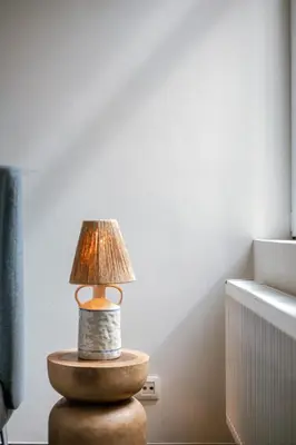 a lamp sitting on top of a table at Right In The City Center Your Ghent Getaway in Ghent
