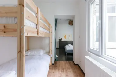 a bedroom with bunk beds and a window at Right In The City Center Your Ghent Getaway in Ghent